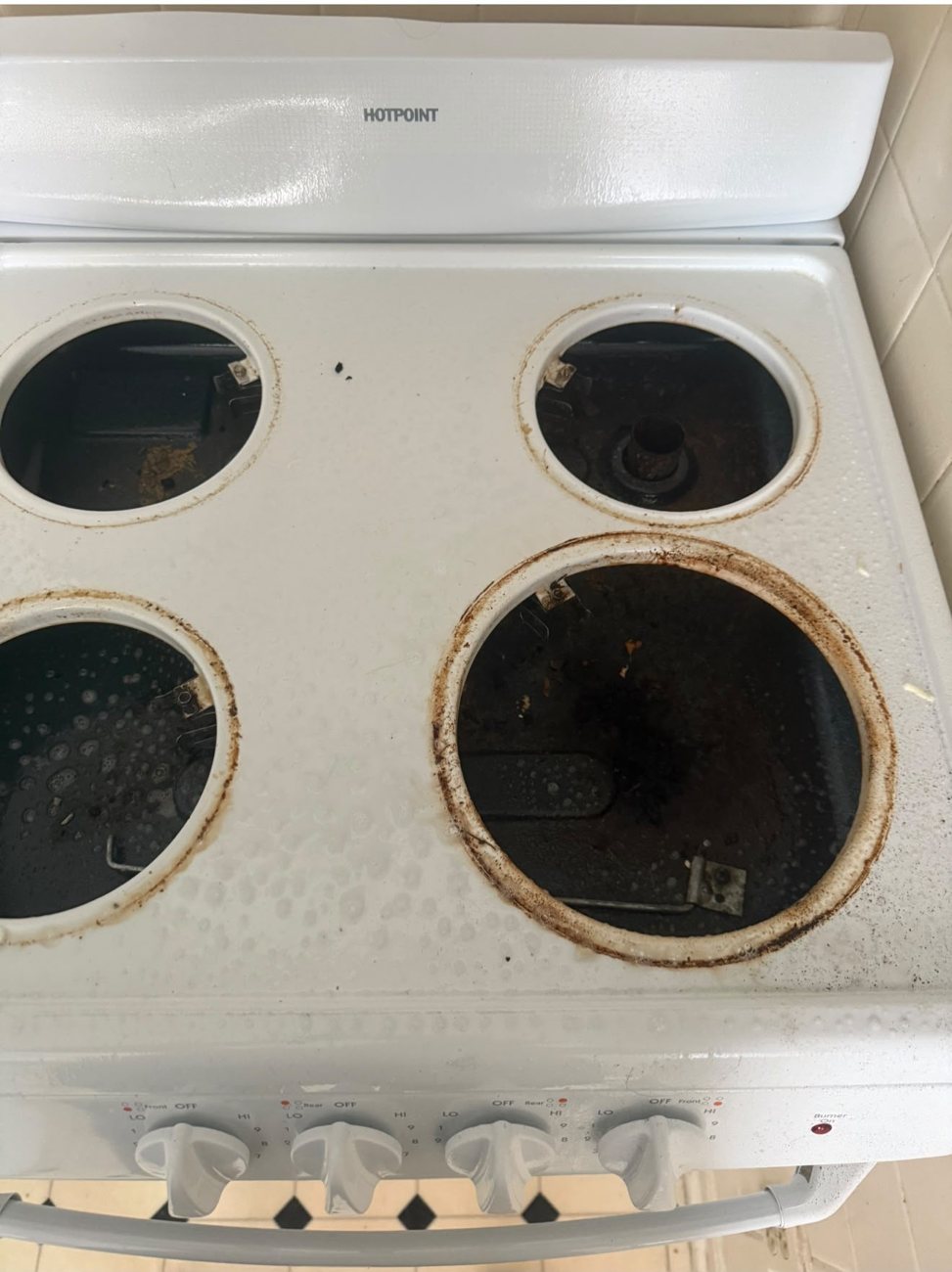 Rusty stovetop before cleaning