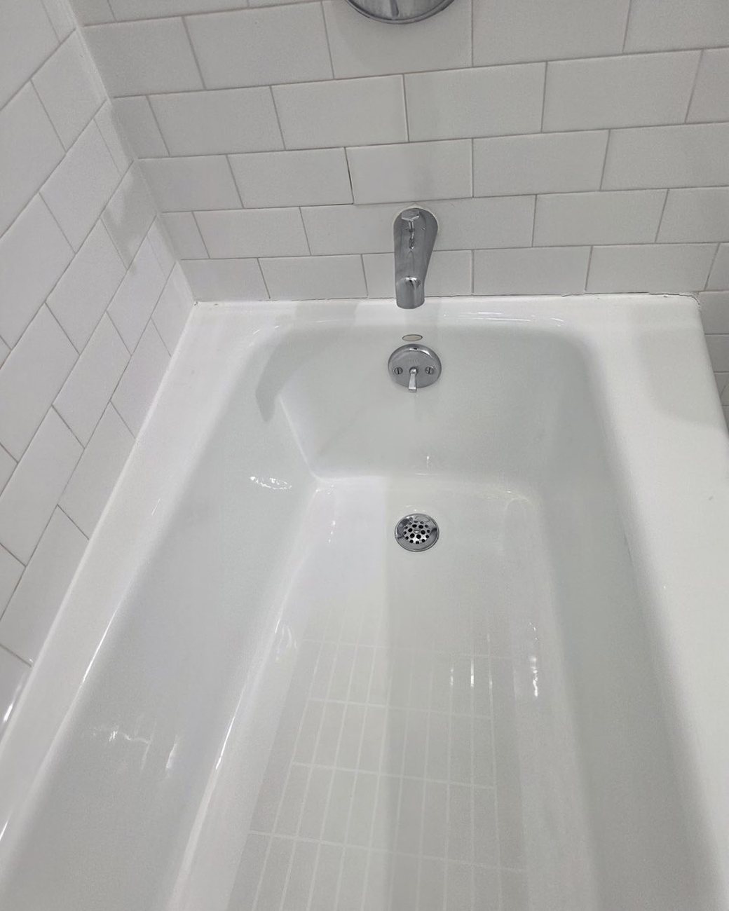 Bathtub after deep cleaning, gleaming white