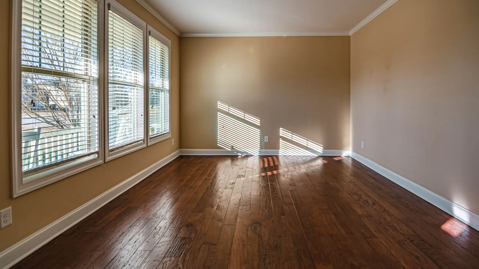 "Empty living room with polished hardwood floors after a professional move-out cleaning in Columbus, Ohio"